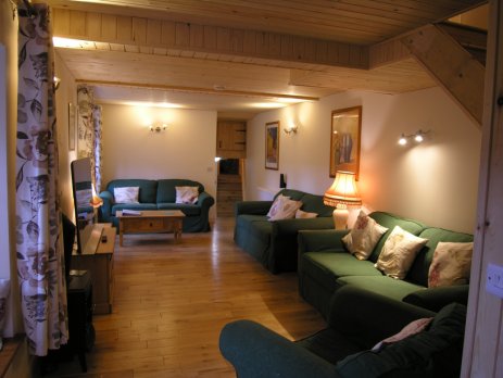 Sitting Room in Selworthy Cottage viewed from the bottom of the staircase